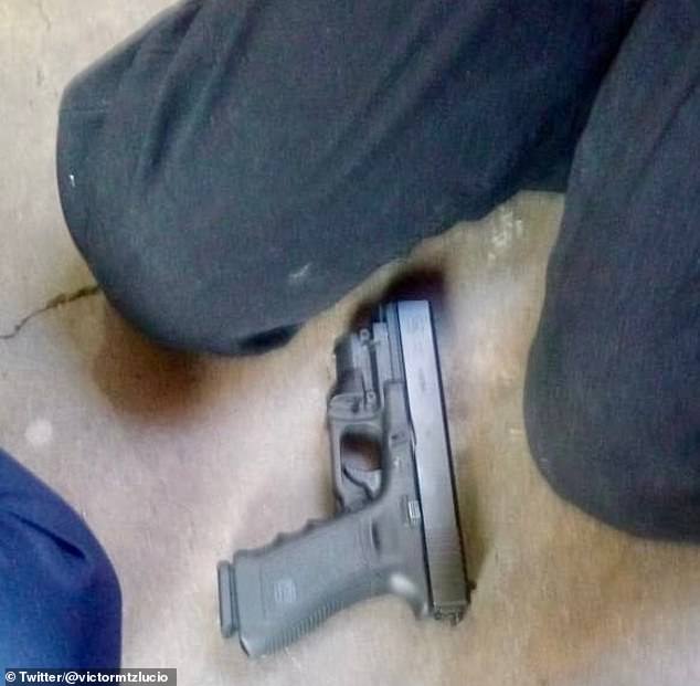 Shocking photos from the scene showed the student's body next to that of his female teacher with a handgun on the floor between the boy's knees.