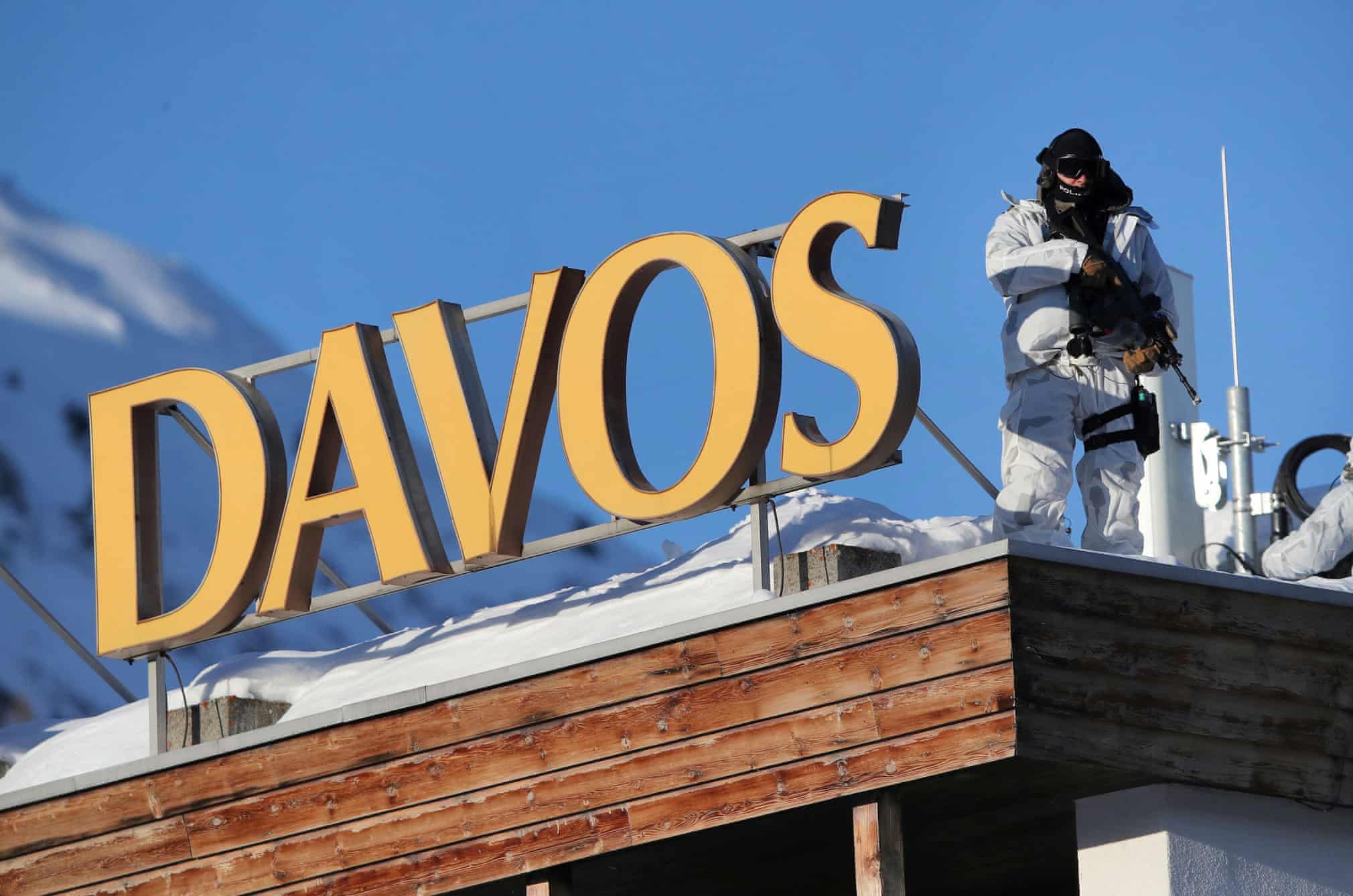 A police officer stands guard ahead of the annual event in Davos