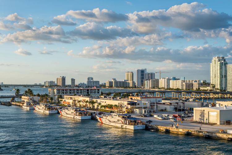 U.S. Coast Guard vessels docked \in Biscayne Bay in the Port of Miami, Florida.

Shutterstock.com