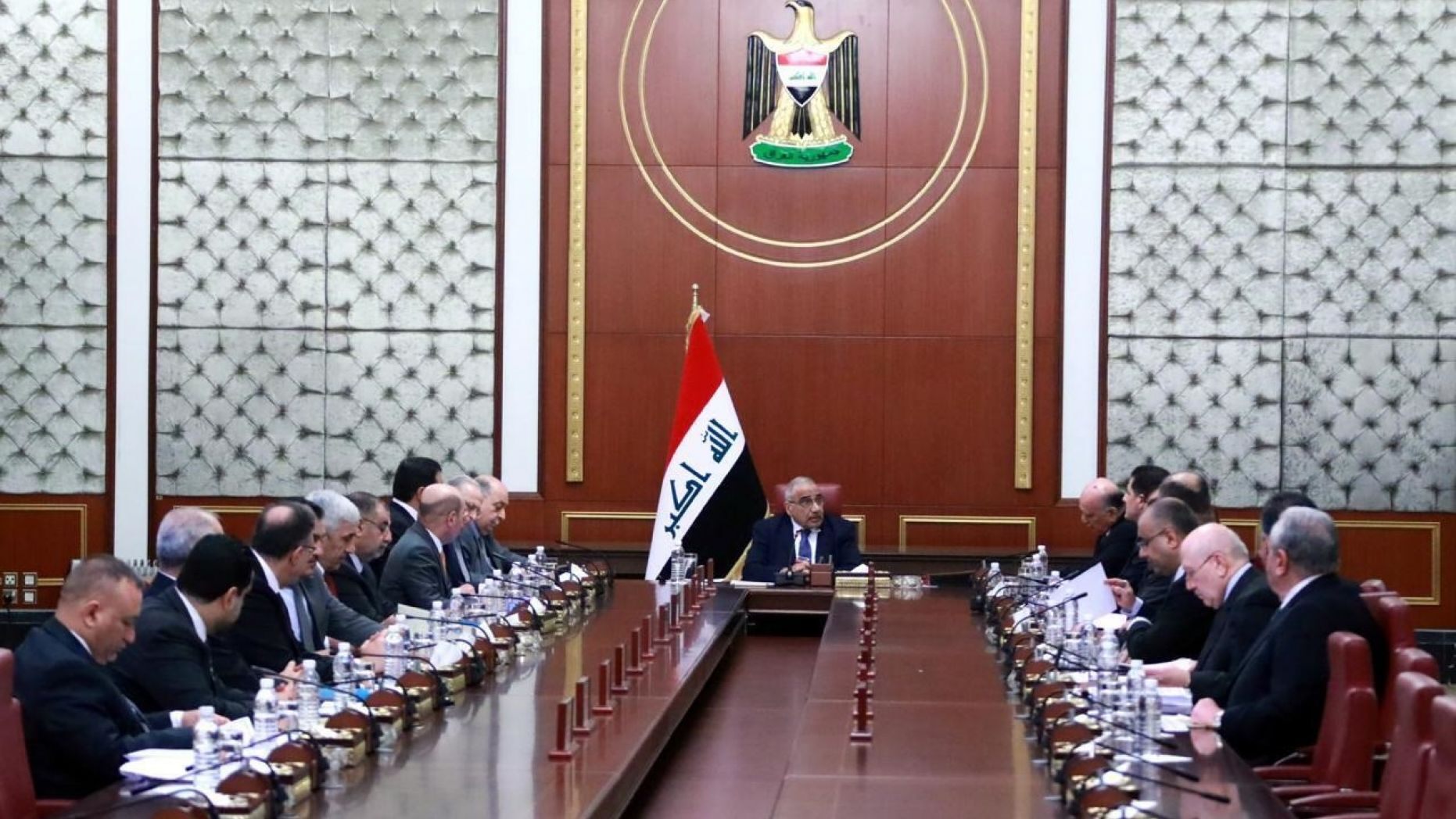 In a photo released by the Iraqi Prime Minister Media Office, Prime Minister Adil Abdul-Mahdi, center, heads a cabinet meeting at the prime minister's office, in Baghdad, Iraq, on Tuesday. Abdul-Mahdi called for American troops to leave the country amid escalating tensions between the U.S. and Iran.