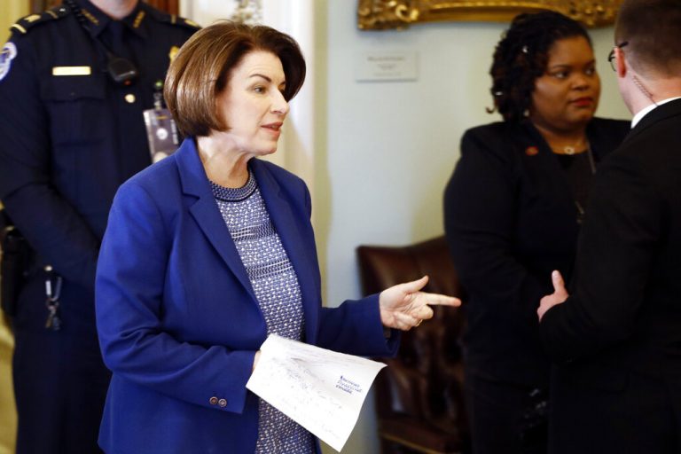 Sen. Amy Klobuchar, D-Minn., walks out of the Senate chamber during a break in the impeachment trial of President Donald Trump at the U.S. Capitol Wednesday Jan 29, 2020,