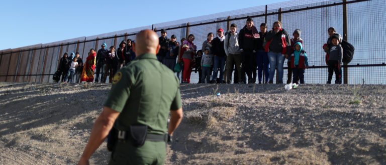 A group of Central American migrants surrenders to U.S. Border Patrol Agent Jose Martinez south of the U.S.-Mexico border fence in El Paso, Texas, U.S., March 6, 2019. 