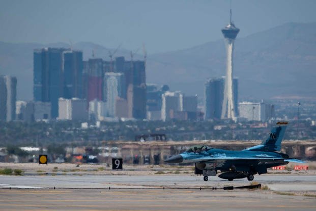 An F-16 Fighting Falcon fighter jet assigned to the 64th Aggressor Squadron (AGRS) taxis onto a runway at Nellis Air Force Base, Nevada, Aug. 8, 2019.