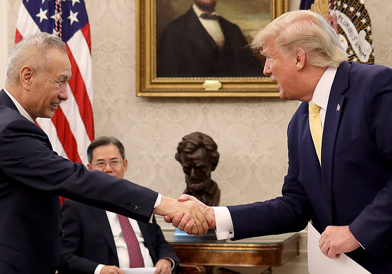 U.S. President Donald Trump shakes hands with Chinese Vice Premier Liu He after announcing a "phase one" trade agreement with China in the Oval Office at the White House October 11, 2019 in Washington, DC.