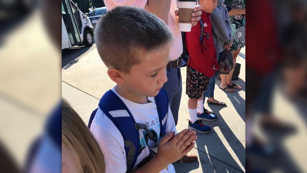 Ezra, age 6, prays before school in Chesterfield, VA. 