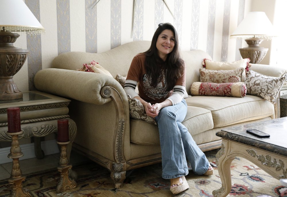Judith Negron is interviewed at her home in Hialeah, Fla., Wednesday, Feb. 19, 2020.
