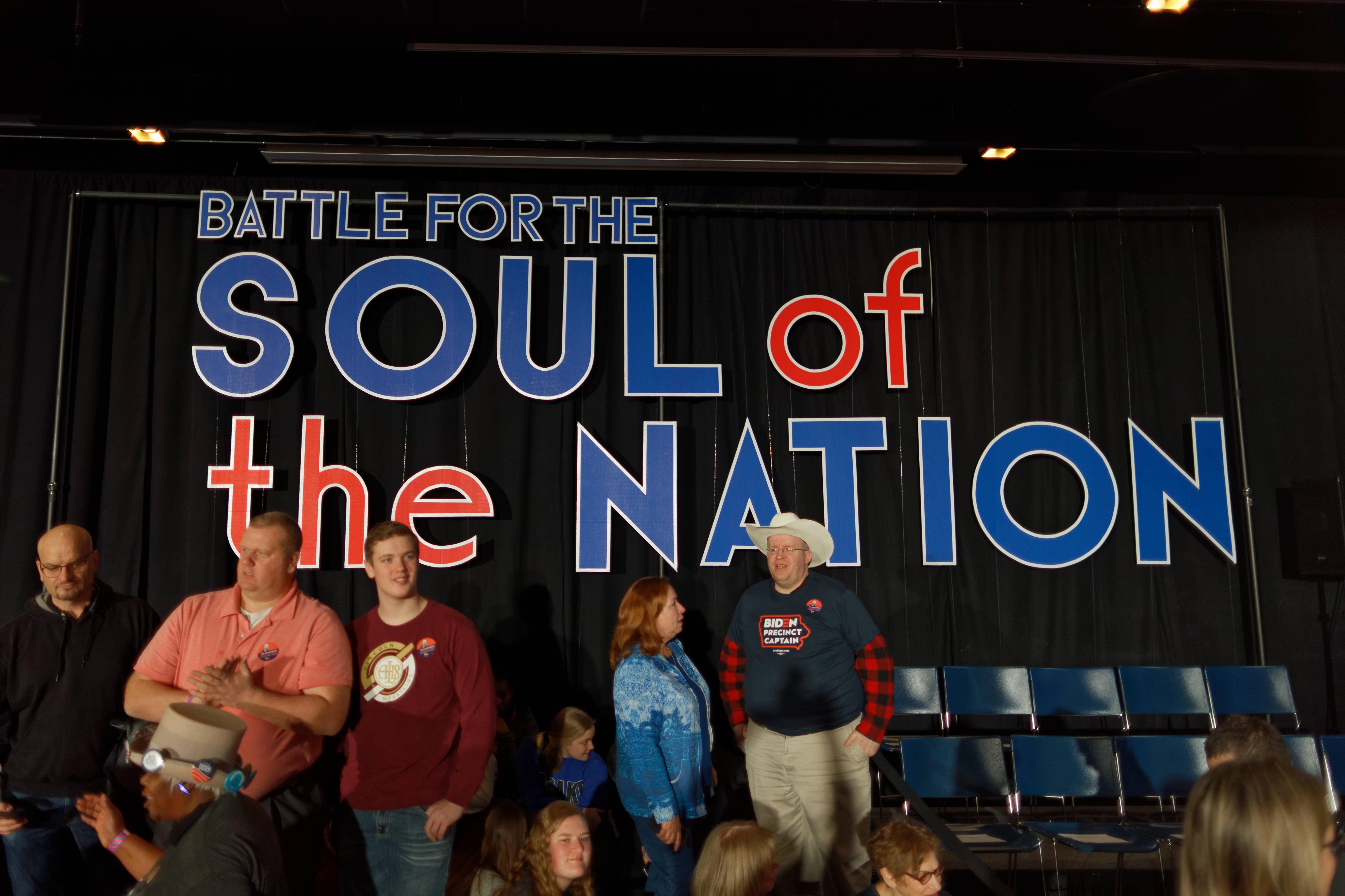 People attend Vice President Joe Biden’s post-caucus party in Des Moines on Monday. The DNC chairman has called for a recanvass after the public release of caucus results has been delayed for days.