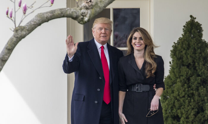 President Donald Trump poses with then White House communications director Hope Hicks