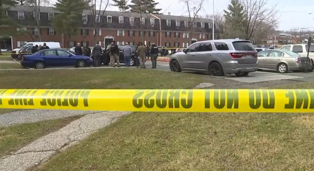 This image provided by WMAR-2 News shows emergency and law enforcement officials responding to the scene of a shooting, 