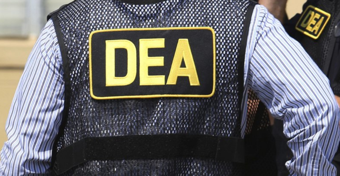 FILE - This June 13, 2016 file photo shows Drug Enforcement Administration (DEA) agents in Florida. On Friday, Feb. 21, 2020,