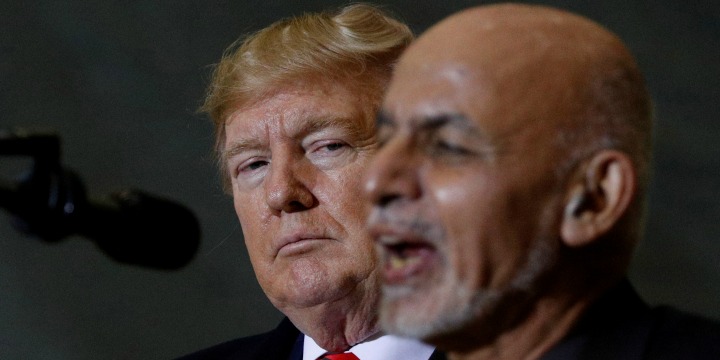 Afghanistan President Ashraf Ghani delivers remarks to US military personnel beside US President Donald Trump during a surprise visit at Bagram Air Base in Afghanistan, 