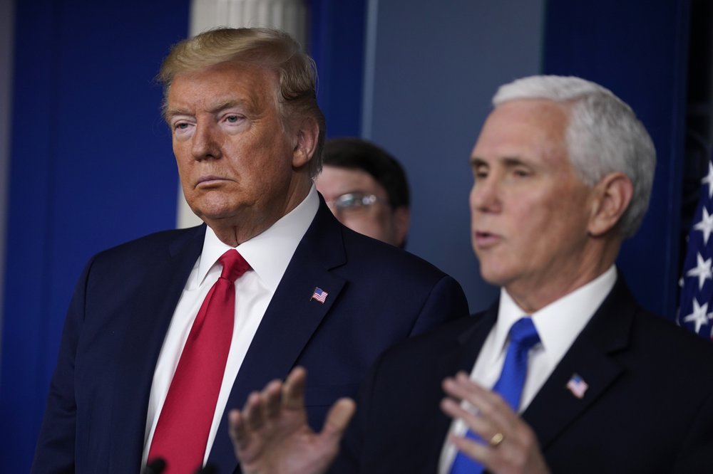 President Donald Trump listens as Vice President Mike Pence speaks during press briefing with the Coronavirus Task Force, at the White House, Wednesday, March 18, 2020, 