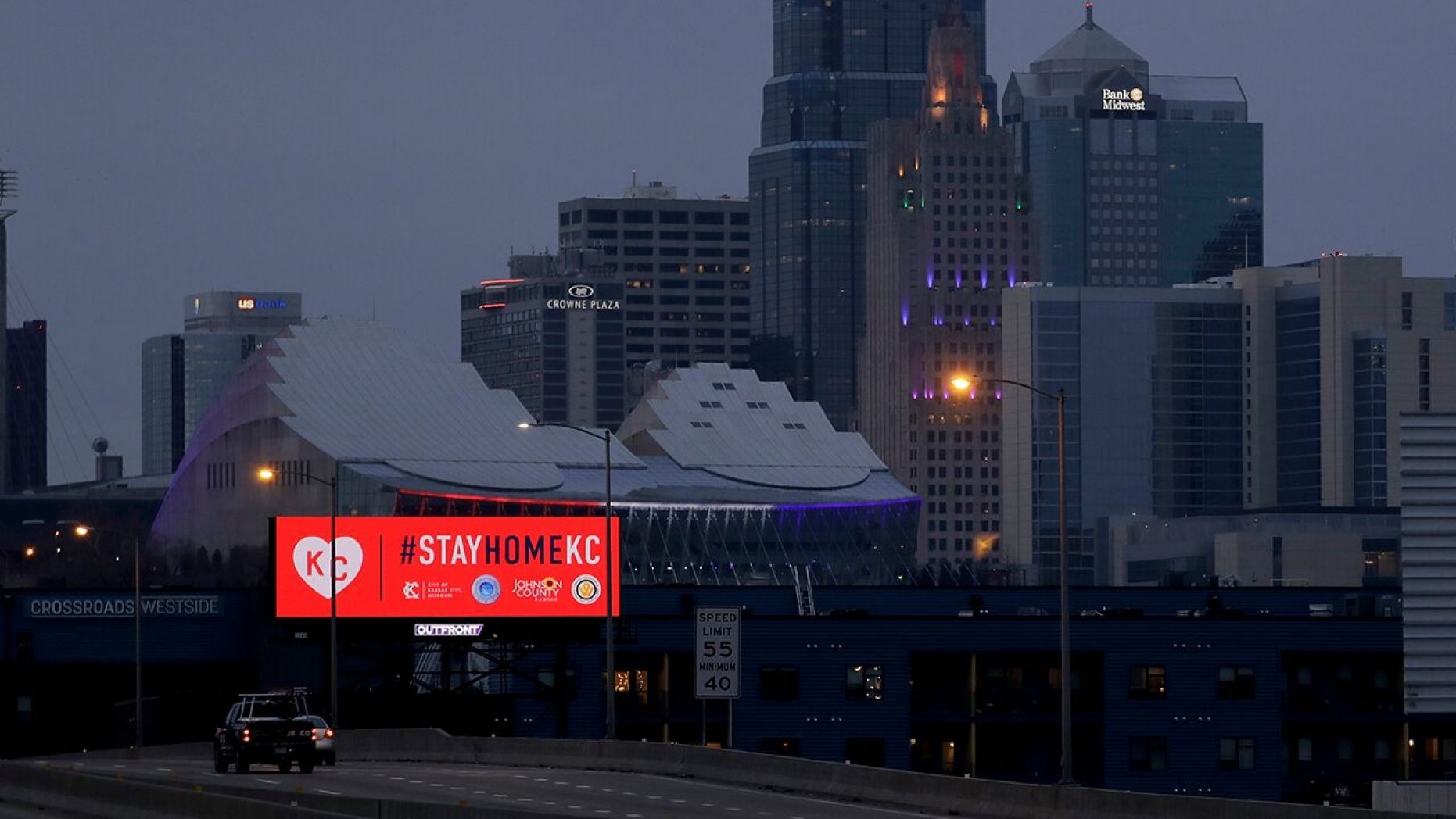 A sign downtown Kansas City, Missouri, urges residents to stay home on Tuesday, 