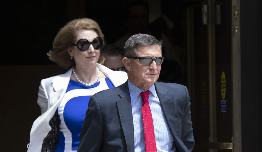 Former National Security Adviser Michael Flynn leaves the federal courthouse in Washington on Monday, June 24, 2019. Flynn's lawyer Sidney Powell is at left.