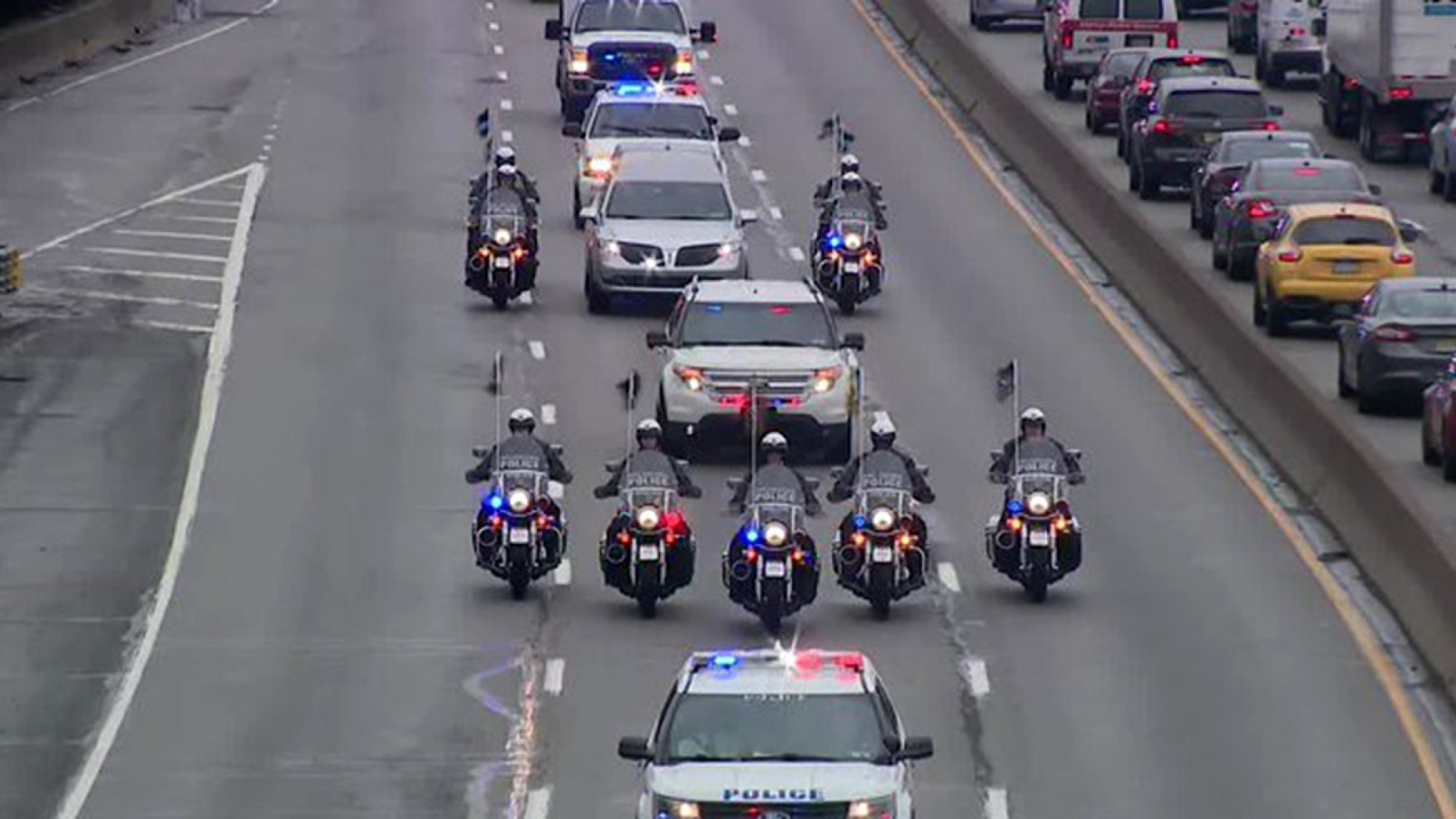 Members of the Philadelphia Police Department escorted the body of fallen officer James O'Connor from the hospital to the morgue