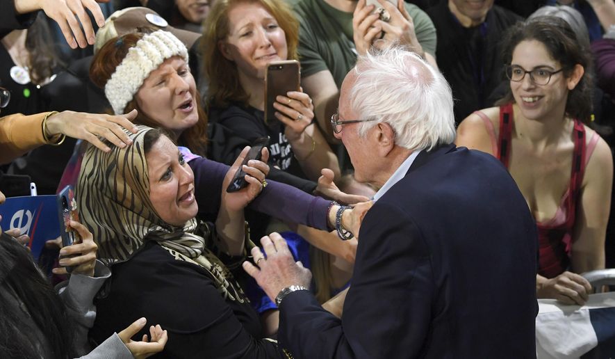 Democratic presidential candidate Sen. Bernie Sanders, I-Vt., greets the audience after speaking at a campaign rally in Springfield, Va., Saturday, Feb. 29, 2020. (AP Photo/Susan Walsh)