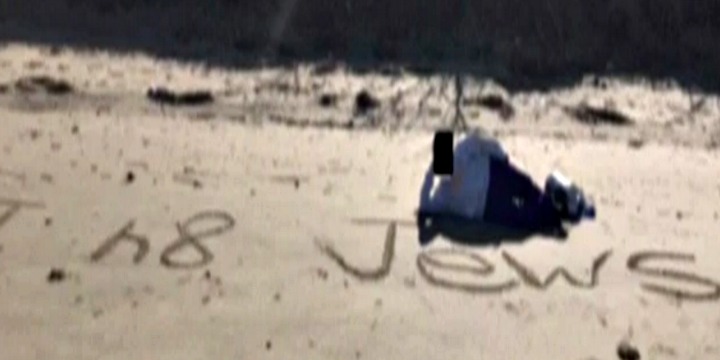 A student from New Jersey’s MAST Academy lying on Sandy Hook Beach alongside an antisemitic epithet aimed at a Jewish classmate.