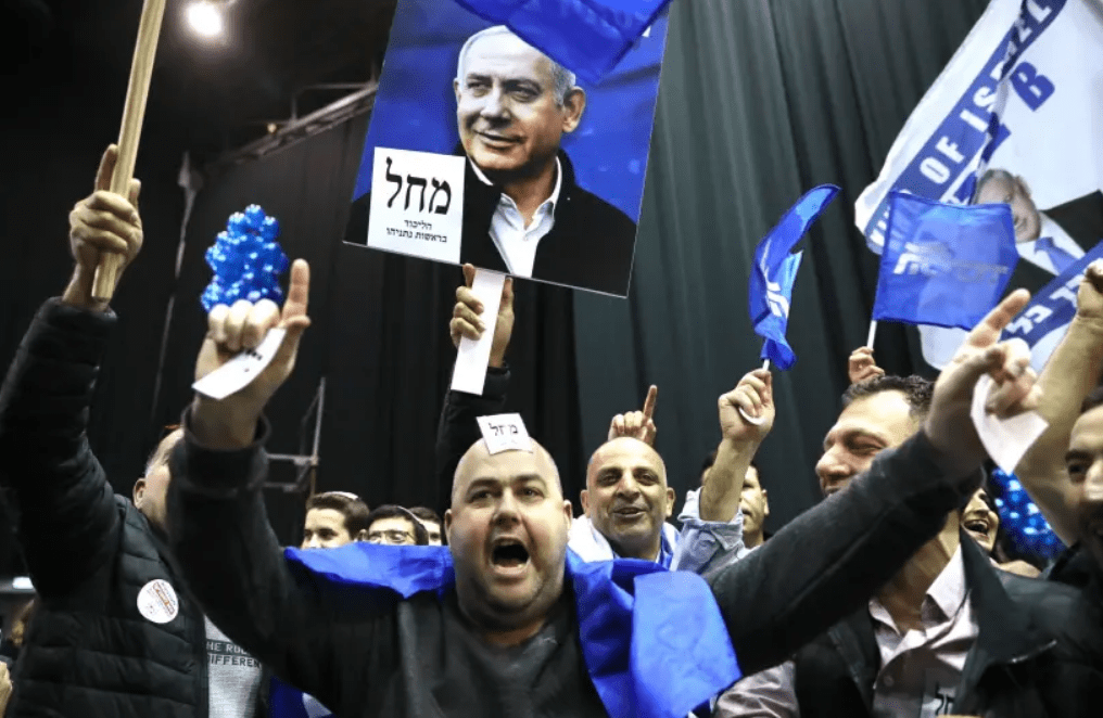 Likud supporters celebrate the exit poll results of the March, 2020 election.
(photo credit: MARC ISRAEL SELLEM)