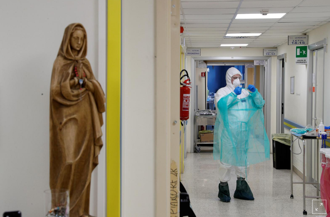 A medical worker in a protective suit is seen at the San Filippo Neri hospital, where patients suffering from the coronoavirus disease