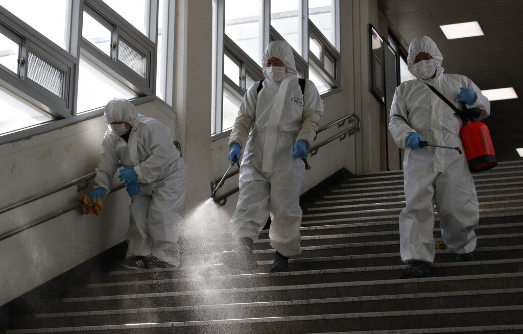 Workers disinfect a subway station in Seoul, South Korea, on Friday. (AP photo/Lee Jin-man)