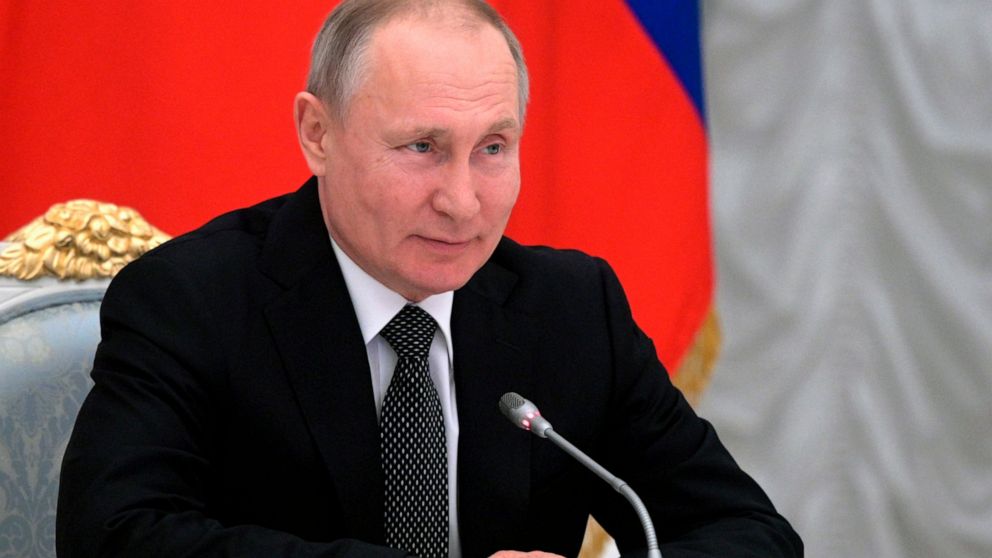 Russian President Vladimir Putin speaks during a meeting with members of a working group created to discuss constitutional amendments in Moscow, Russia, Wednesday, Feb. 26, 2020. The working group proposed holding a nationwide vote on the changes on April 22.