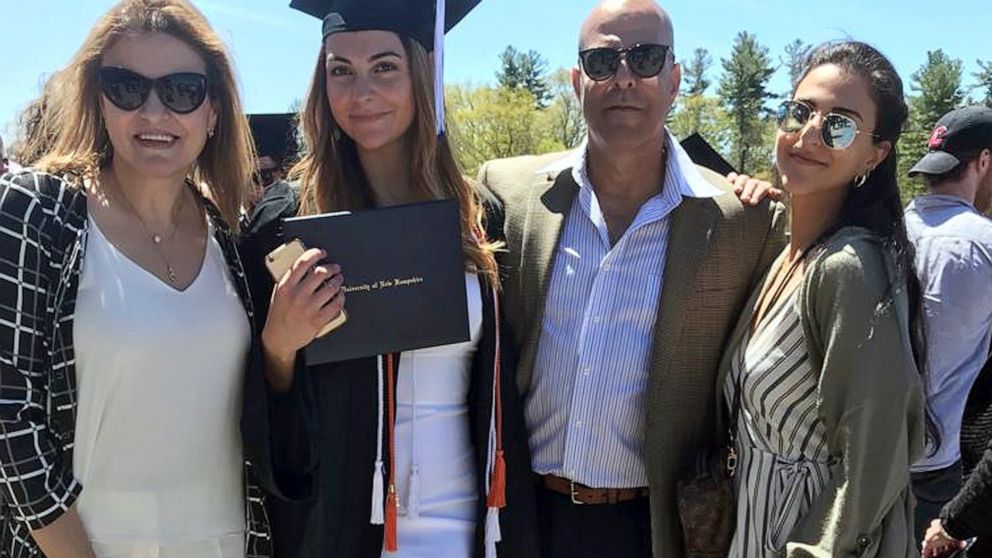 In this May 2019 file photo provided by Guila Fakhoury, her father Amer Fakhoury, second right, gathers with family members at the University of New Hampshire in Durham, N.H.
