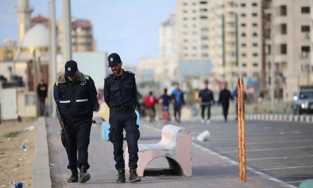 Police patrol the Gaza city seafront to enforce the territory’s coronavirus restrictions.