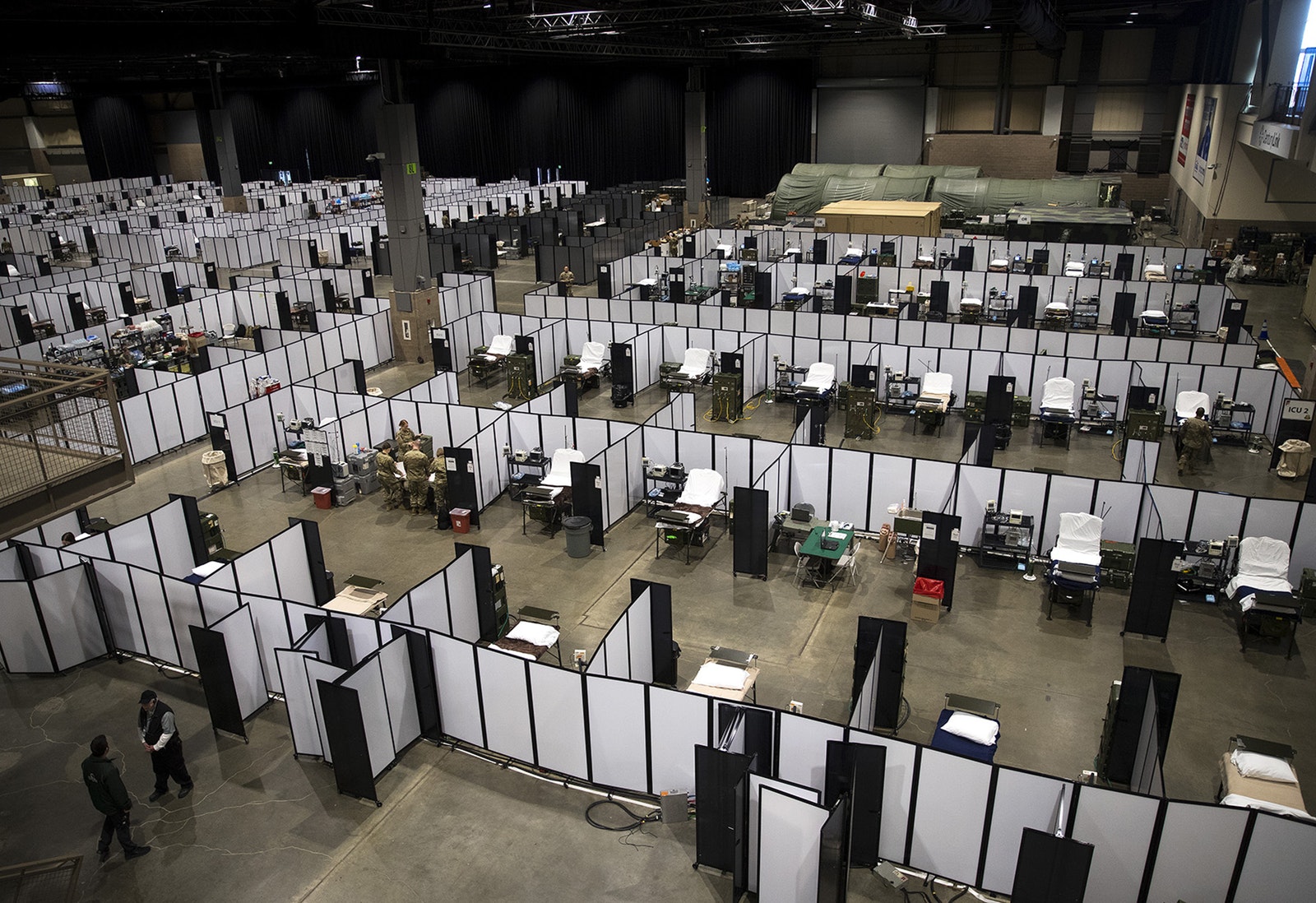 U.S. Army soldiers set up a military field hospital inside CenturyLink Field Event Center on Sunday, April 5, 2020, in Seattle. 