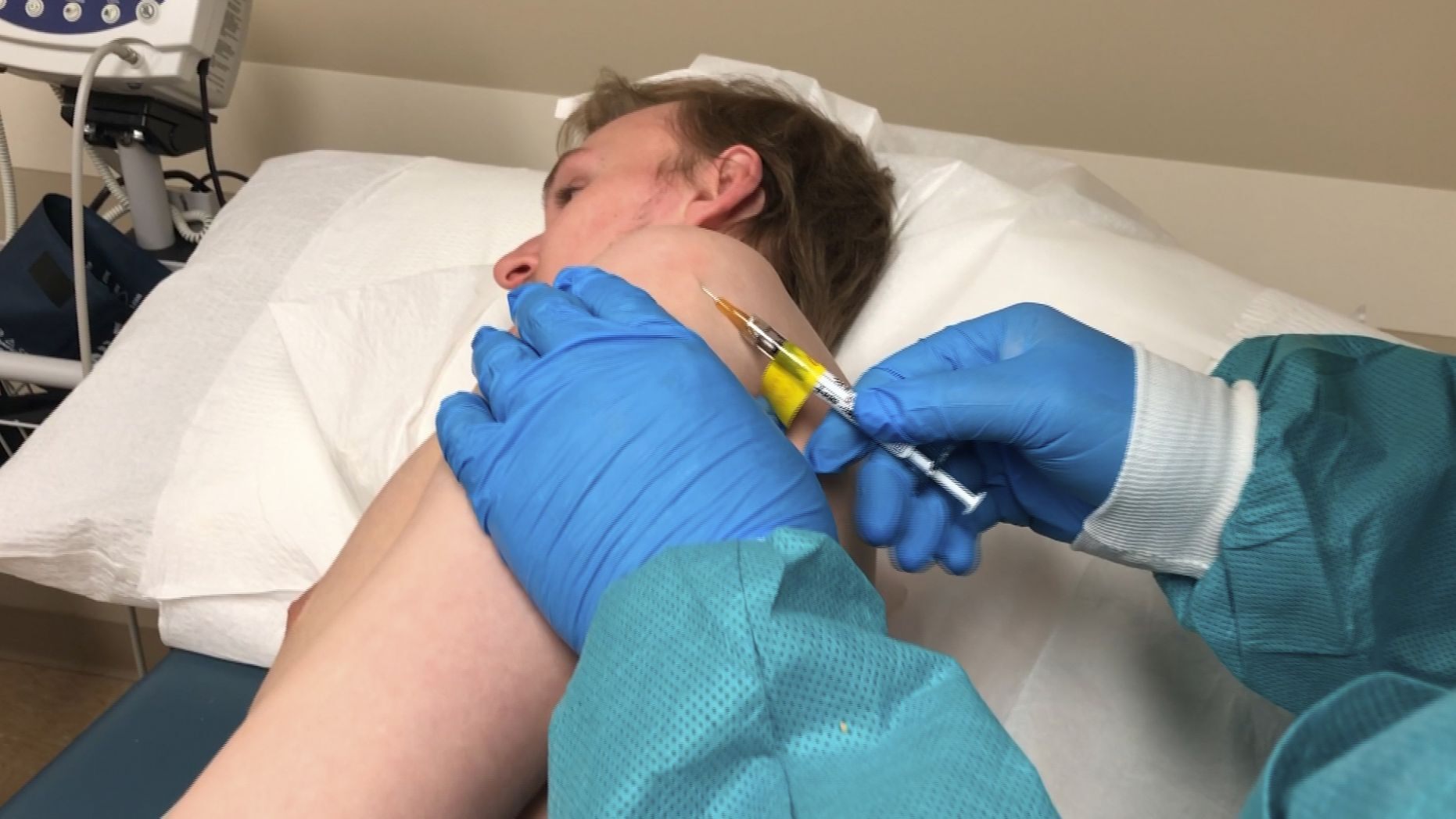 In this Wednesday, April 8, 2020 photo provided by the Center for Pharmaceutical Research, a participant in a COVID-19 coronavirus vaccine trial 