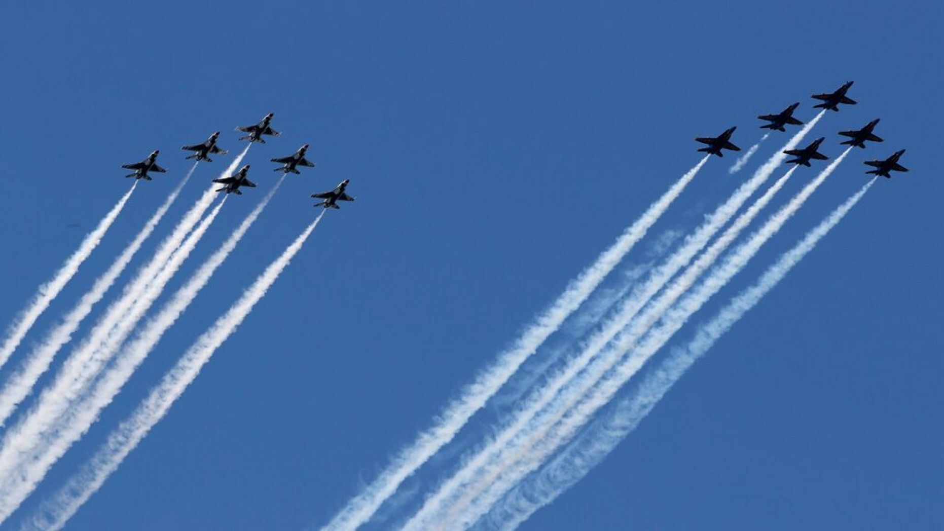 The U.S. military's elite flight demonstration squadrons -- the Navy's Blue Angels and the Air Force's Thunderbirds -- perform