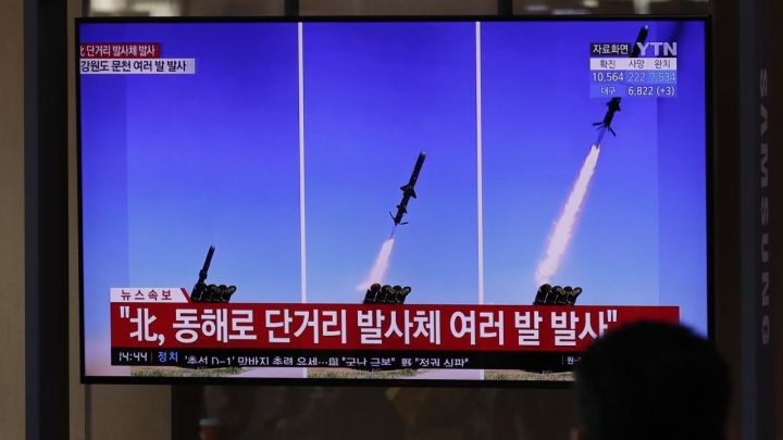 A TV screen airing reports about North Korea's firing missiles with file images of missiles at the Seoul Railway Station in Seoul, South Korea,