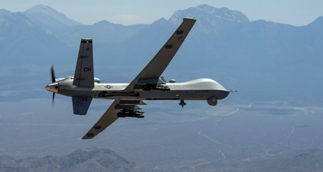 An MQ-Reaper drone remotely piloted aircraft performs aerial maneuvers over