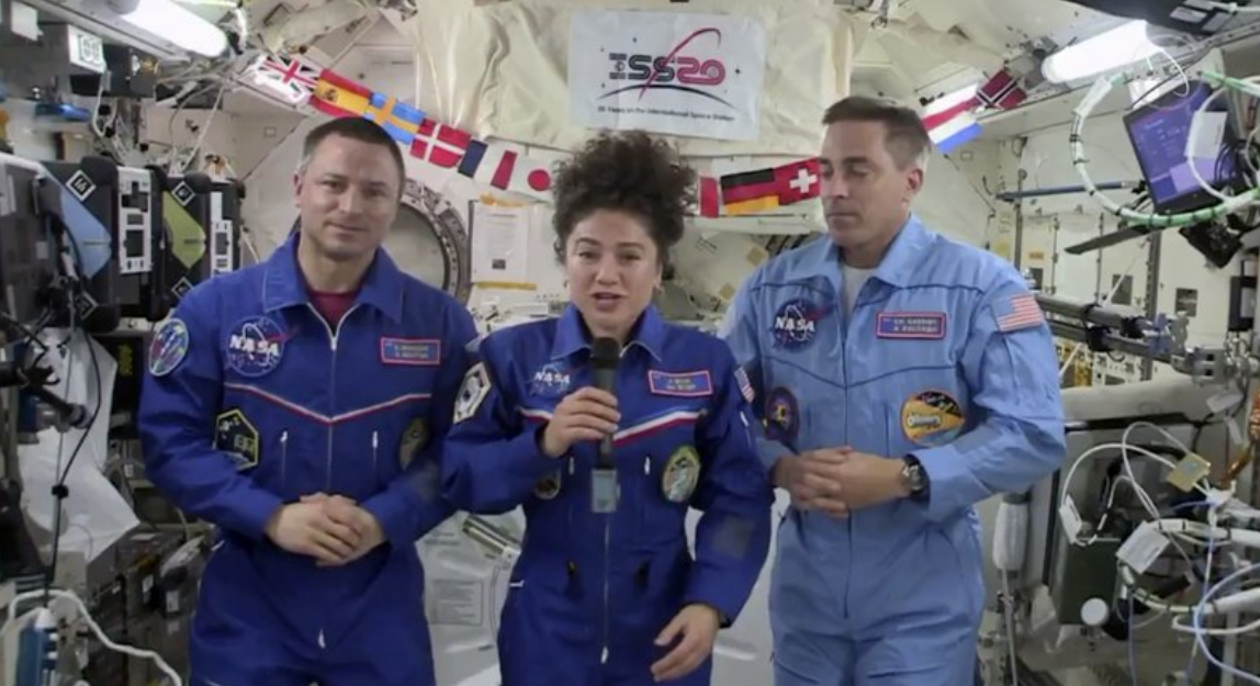 In this image from video made available by NASA, U.S. astronaut Jessica Meir speaks, accompanied by Andrew Morgan and Chris Cassidy, 