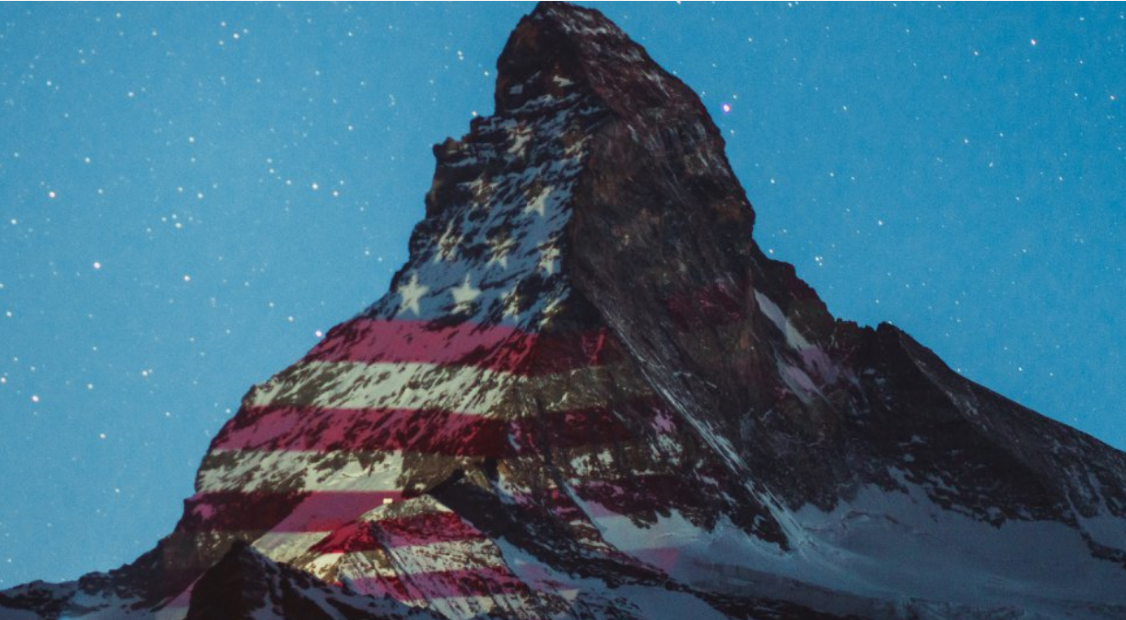 American flag image projected on the iconic Matterhorn mountain in the Swiss Alps. 