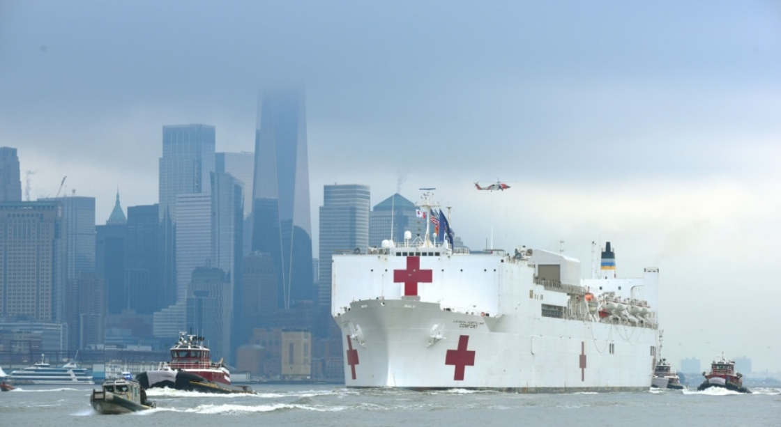 Coast Guard assets, along with New York Police Department and New York Fire Department assets, provide a security escort for the USNS Comfort arrival into New York Harbor, March 30, 2020.