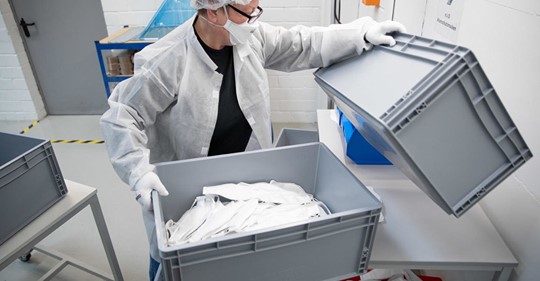An employee of Zender Germany GmbH textile company, an automotive supplier in Osnabrueck, Germany, works on April 6, 2020, 
