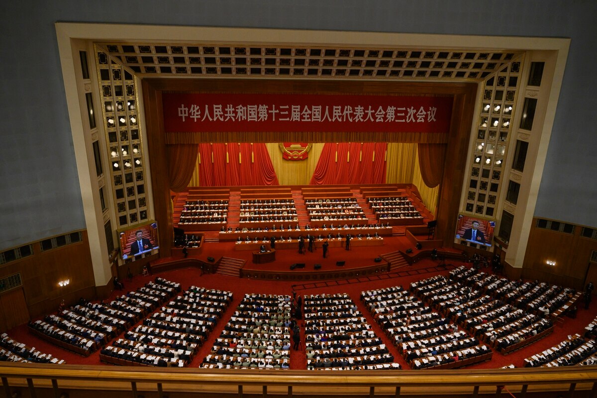 China's Communist Party leaders and delegates, including President Xi Jinping, sit at the opening of the National People's Congress on May 22, 2020,