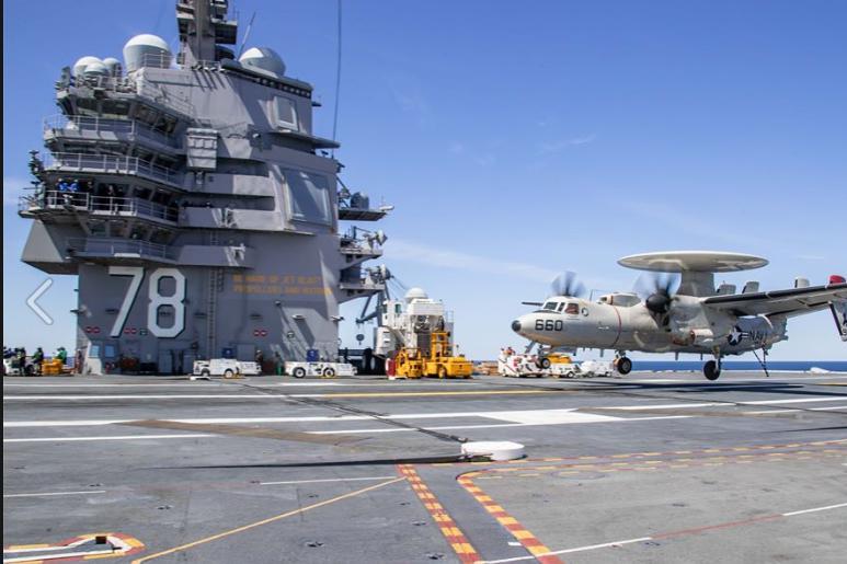 An E2-D Advanced Hawkeye aircraft touches down on the aircraft carrier USS Gerald R. Ford. 