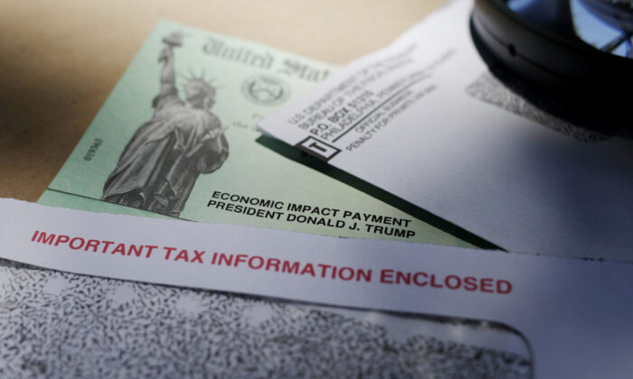 President Donald Trump's name is seen on a stimulus check issued by the IRS ,