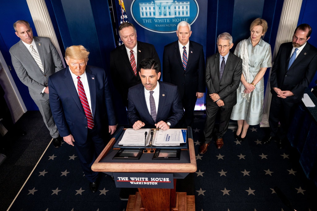 Chad Wolf, center, the acting secretary of Homeland Security, with President Trump and members of the coronavirus task force in March. 