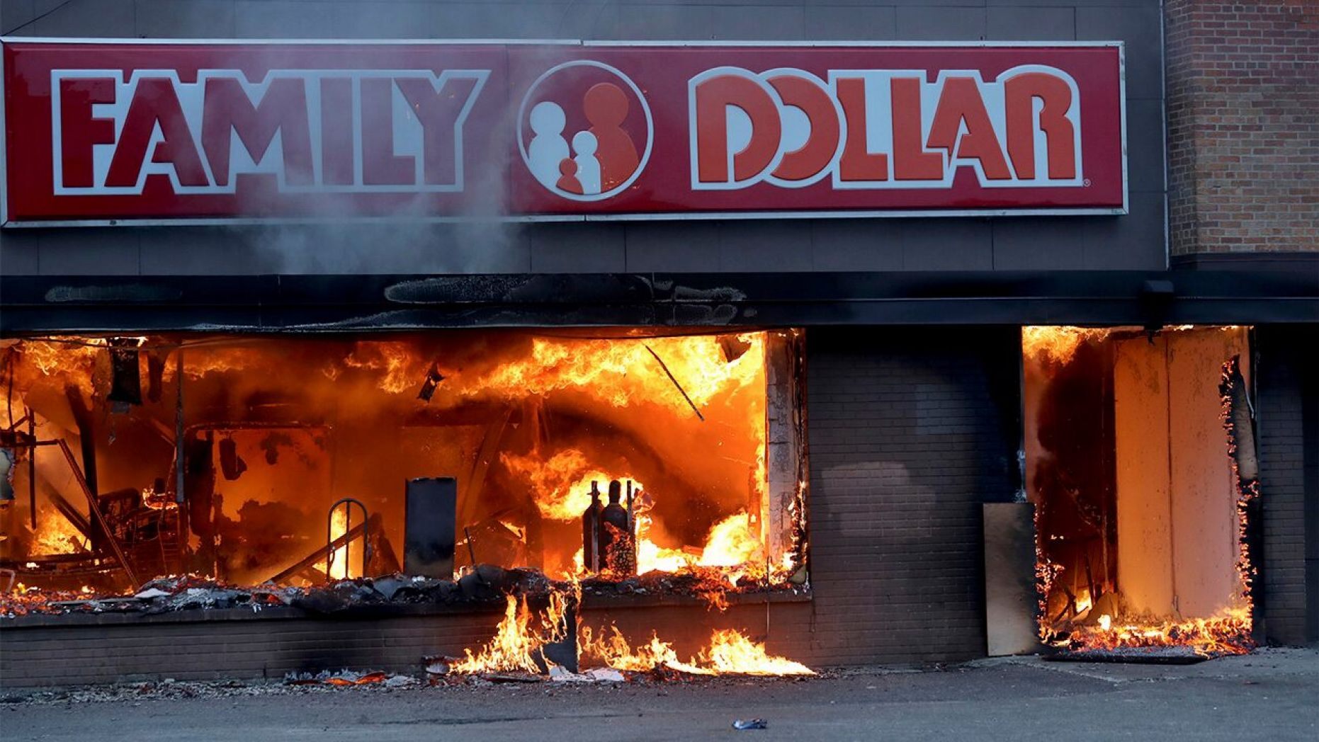 Fire burns inside The Family Dollar Store after a night of unrest and protests in the death of George Floyd early Friday, May 29, 2020 ,