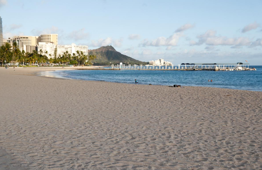  FILE PHOTO: Waikiki Beach is nearly empty due to the business downturn caused by the coronavirus disease (COVID-19) in Honolulu, Hawaii, U.S. April 28, 2020.