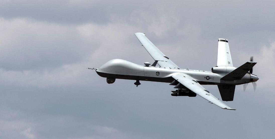 An MQ-9 Reaper remotely piloted aircraft performs aerial maneuvers over Creech Air Force Base, NV., June 25, 2015. 