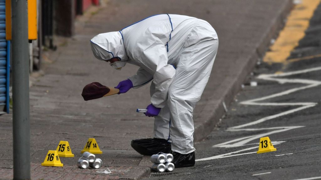A forensic officer at the scene in the village of Pen Y Graig