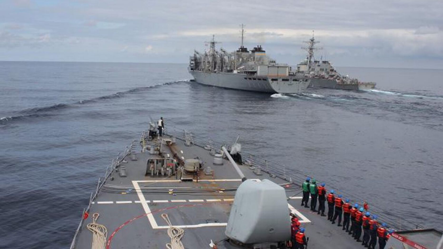 The Arleigh Burke-class guided-missile destroyer USS Donald Cook makes her approach alongside USNS SUPPLY and USS Porter for a connected replenishment to receive fuel and stores on April 28. 