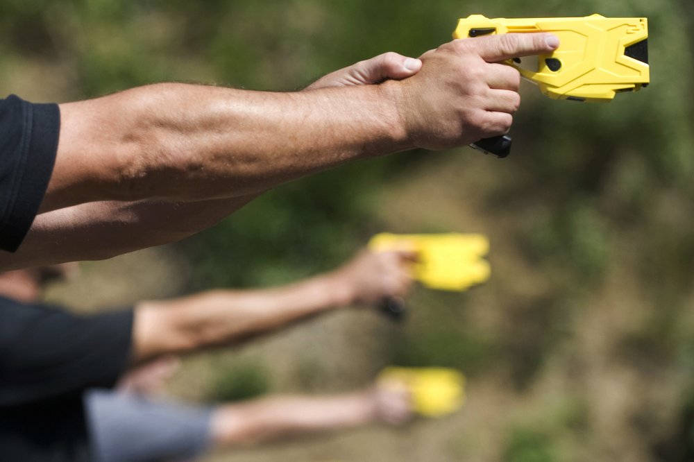 FILE- In this Sept. 25, 2012, file photo, Cherry Hill Township Police Officer Patrick Higgins takes part in a stun gun training session at the Gloucester Township, N.J., 