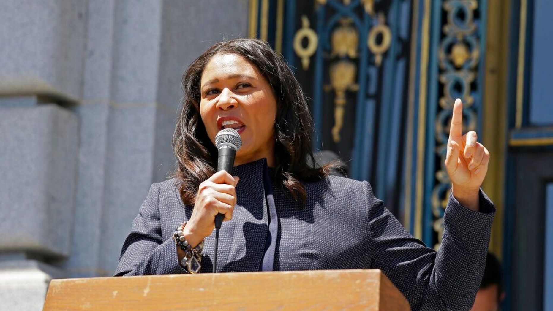 FILE: San Francisco Mayor London Breed speaks to a group protesting police racism outside City Hall in San Francisco.