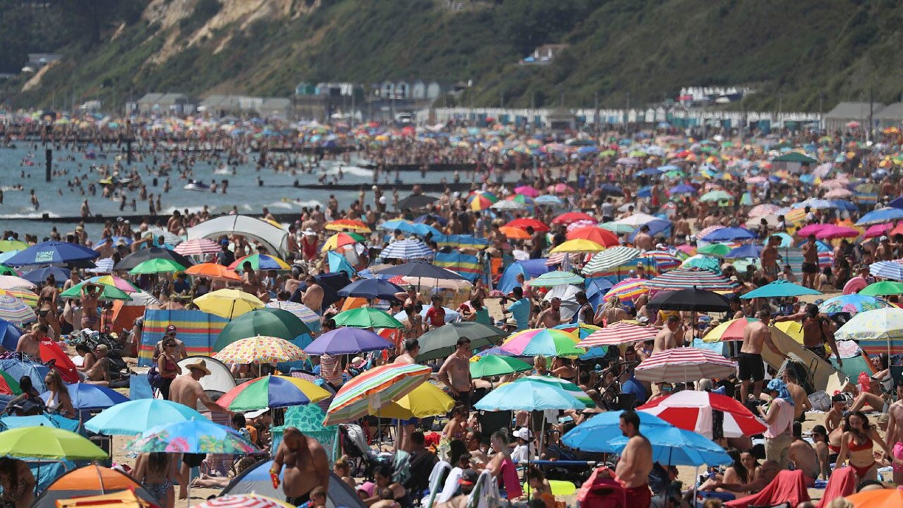 Crowds gather on the beach in Bournemouth as the U.K. experience a heat wave, in Bournemouth, England, on Thursday. 