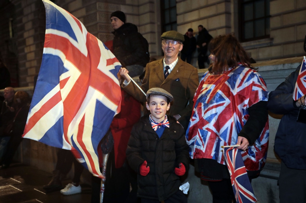 Brexit supporters celebrate leaving the European Union as they congregate in Parliament Square Dec. 31. The Home Office said Friday that more than 3.3 million European Union residents can remain in Britain after Brexit.