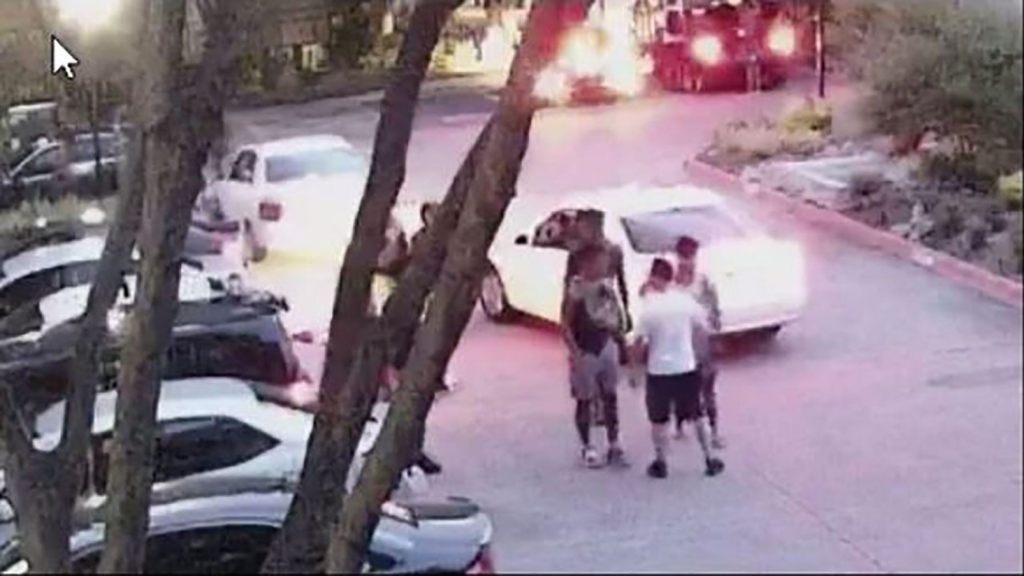 The off-duty officer, seen wearing shorts and a t-shirt, identified himself as a Dallas police officer before telling the group to leave. (Dallas Police Department)